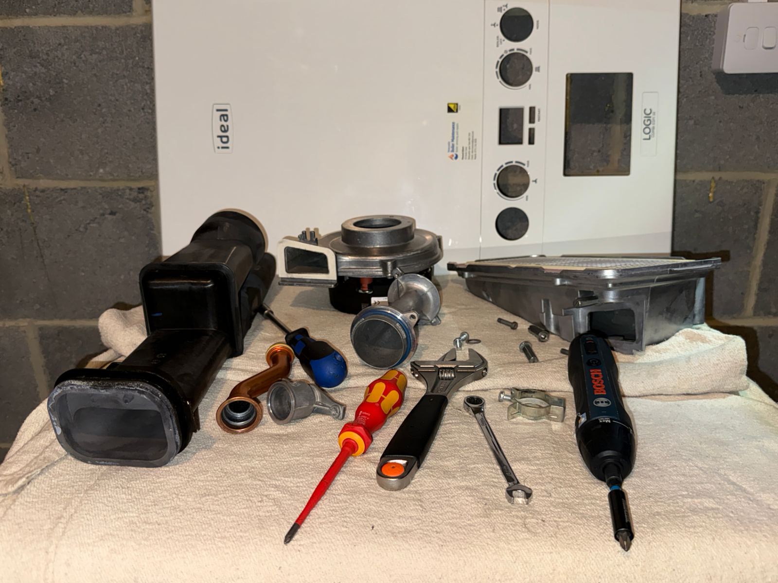 Gas Safe registered engineer diagnosing a boiler that will not fire up